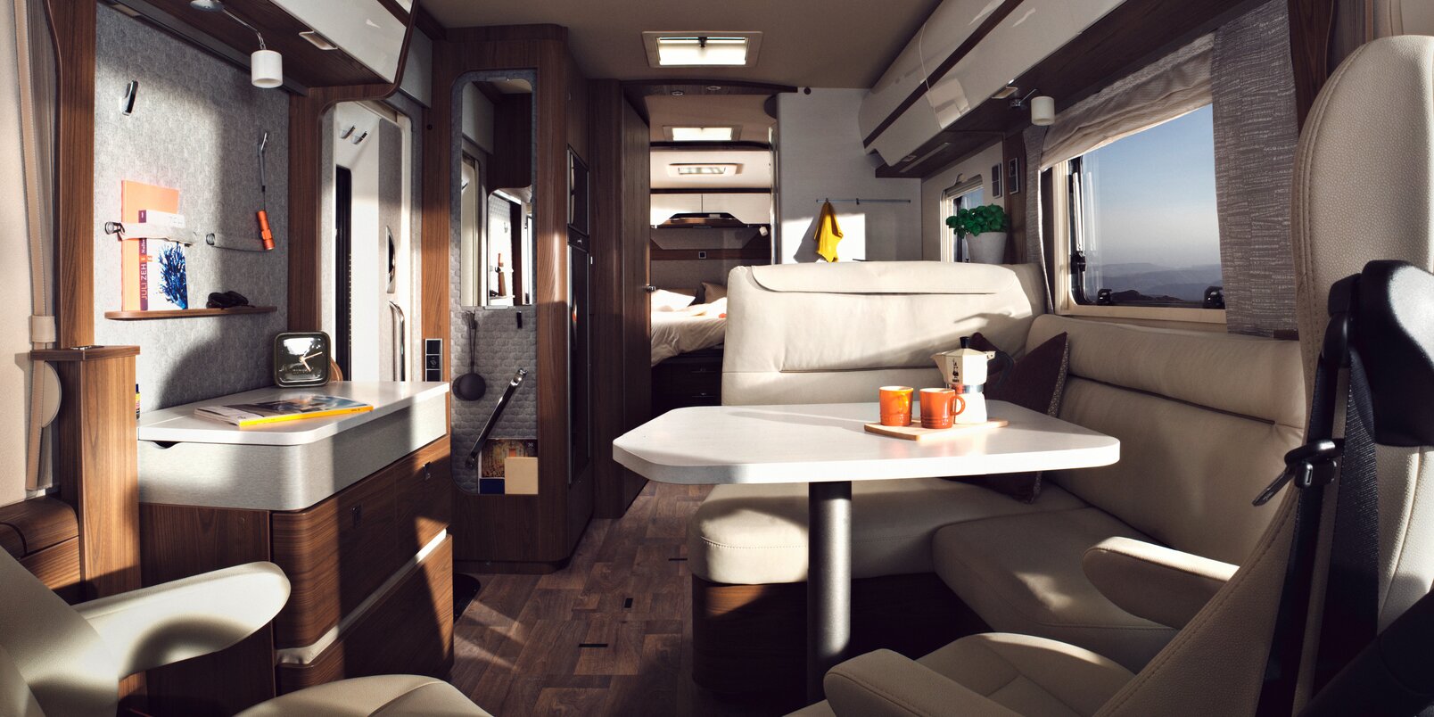 Brightly designed interior of the HYMER-B-MasterLine with seating area, sideboard and lots of storage spaces and shelves