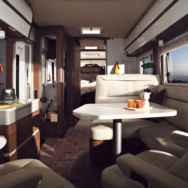 Brightly designed interior of the HYMER-B-MasterLine with seating area, sideboard and lots of storage spaces and shelves