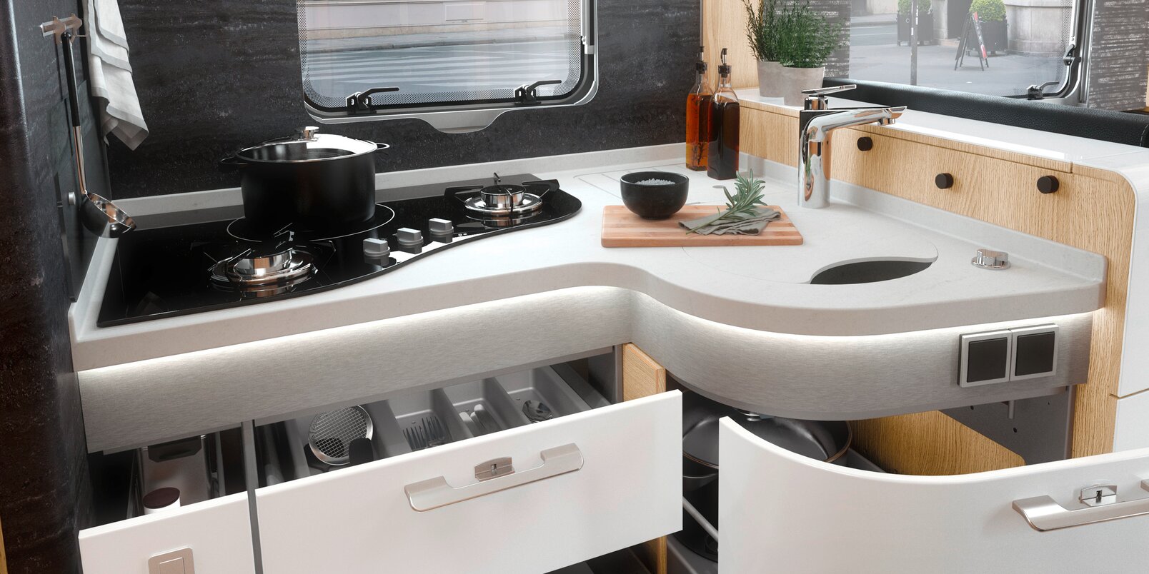 Kitchen block with open drawers, hob and work surface in the HYMER MasterLine