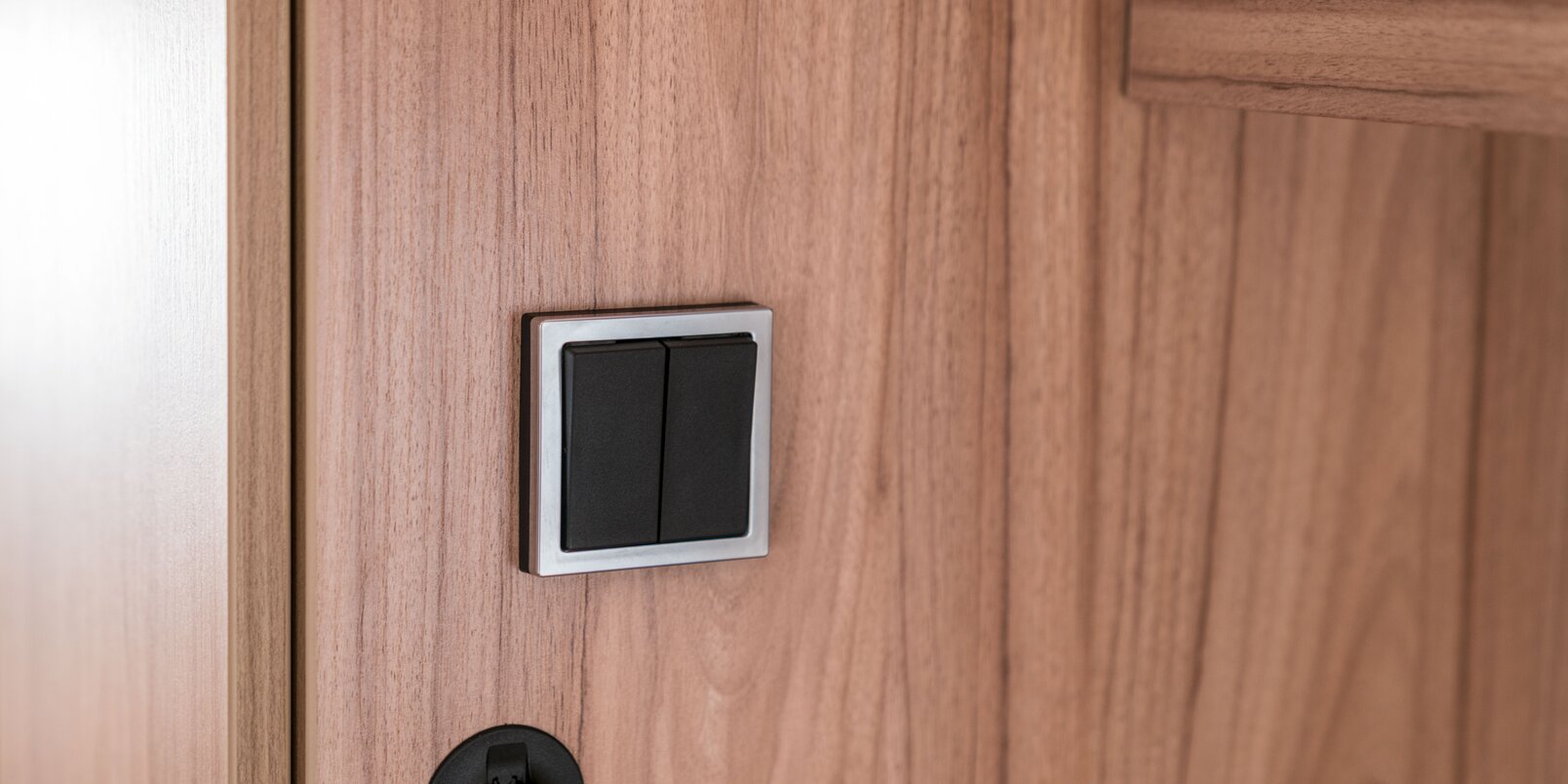 Wall-mounted light switch in the HYMER Exsis-i motorhome