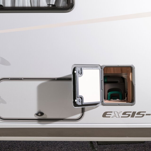 Opened external flap for the loading compartment of the toilet cassette in the HYMER Exsis
