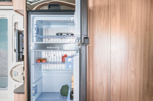 Open refrigerator with freezer compartment in the HYMER Exsis-t motorhome