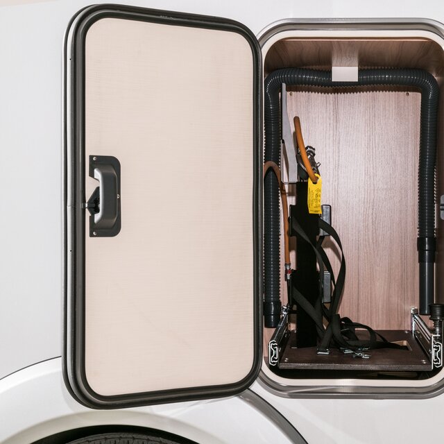 Outside storage compartment with open flap for gas bottles on the HYMER Exsis-t