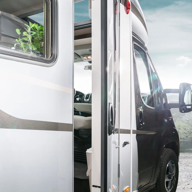 Ajar entrance door with integrated rubbish bin in the HYMER Exsis-t motorhome