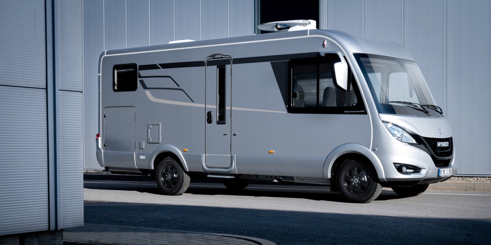 HYMER B-Class ModernComfort I on a Mercedes chassis in front of the factory
