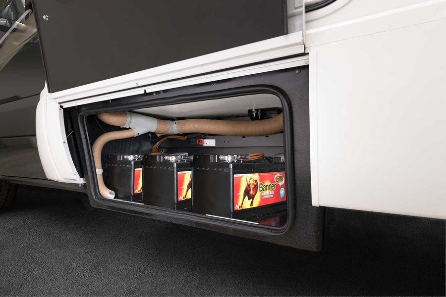 Self-sufficiency package for living area batteries, the HYMER Smart Battery System in the storage compartment that is open from the outside on the HYMER ML-T 580