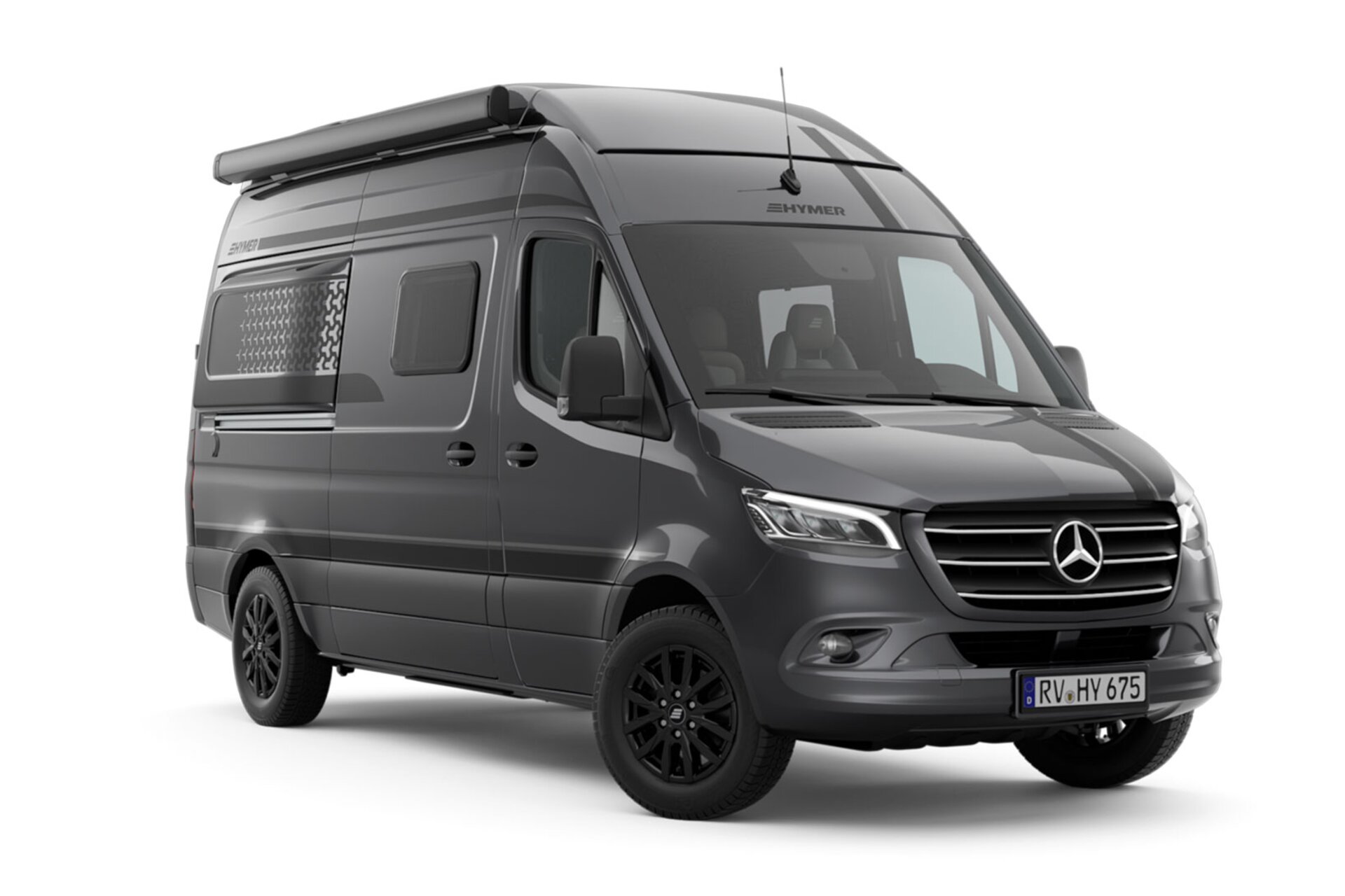 Découpe d'un camping-car gris foncé, vue de l'avant en biais sur le côté passager du véhicule.	