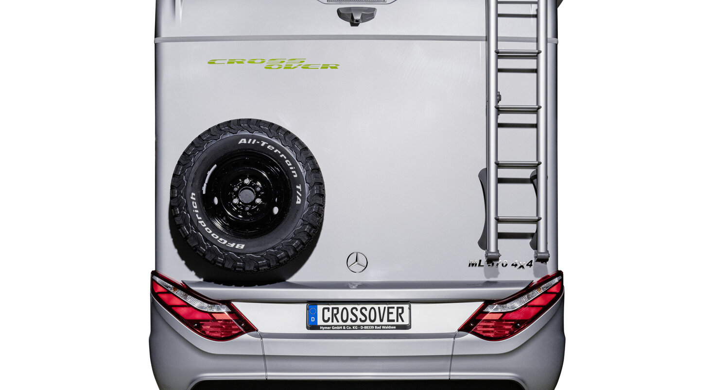 Rear section of the HYMER ML-T 570 CrossOver motorhome on a Mercedes chassis with spare wheel and rear ladder