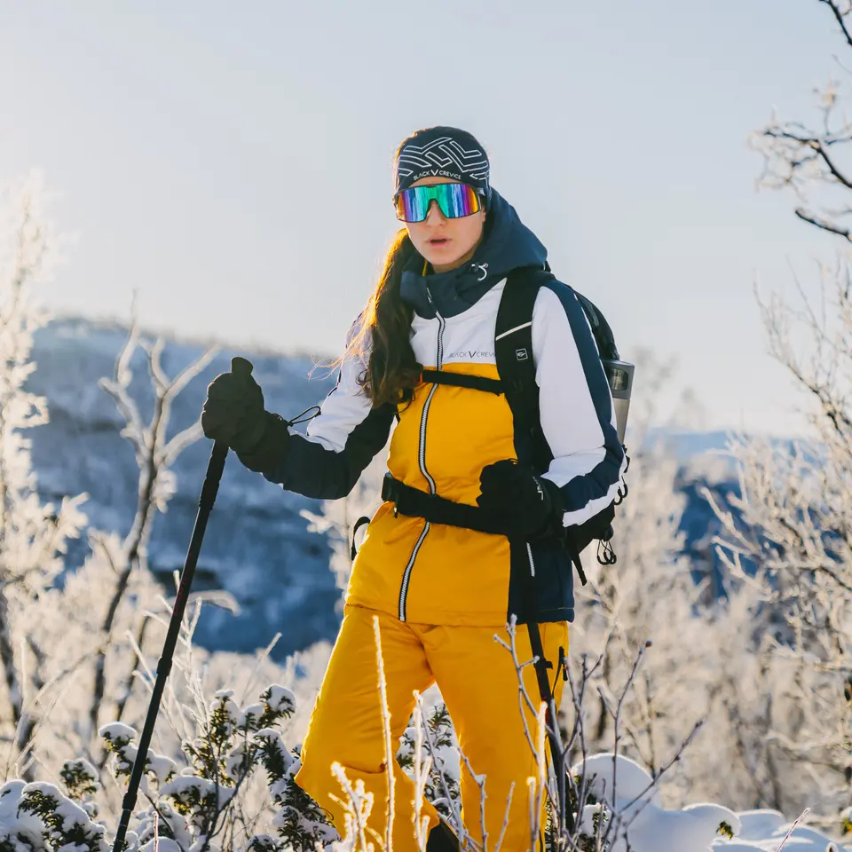 Woman hiking in a snowy landscape